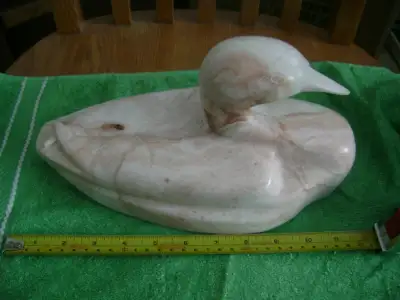 Carved stone duck, View more