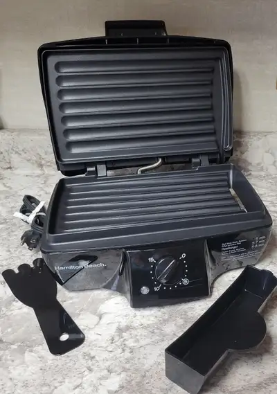 Includes plastic cleaning tool and removeable drip tray. Very clean, only used a few times.