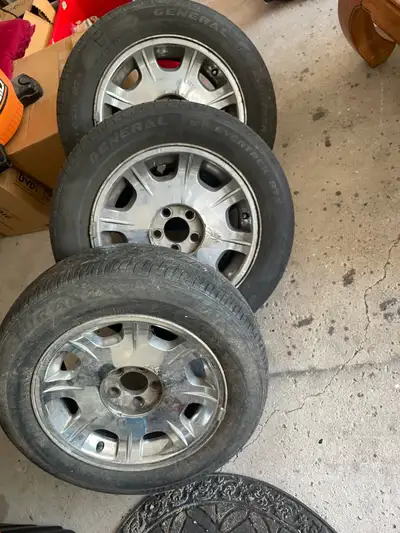 3 rims and tires — tires are old Came off a Chrysler 300 $20 take all 3