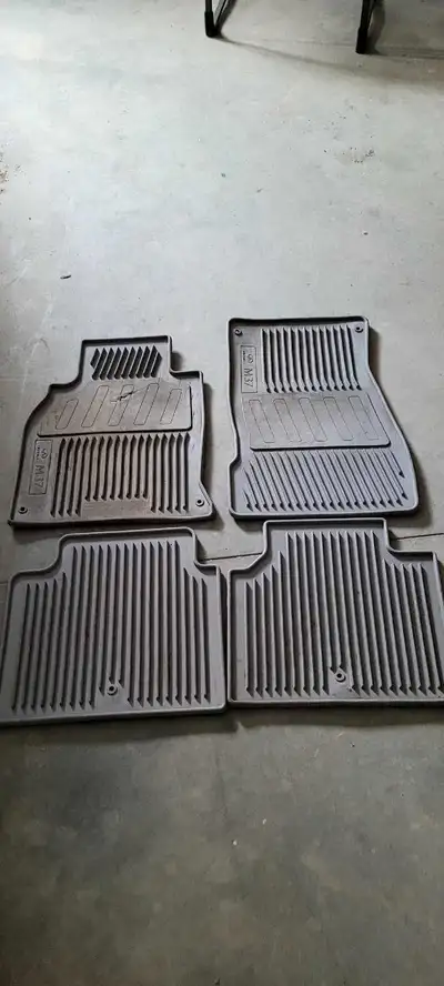 Floor mats from a 2012 infiniti m37x. They are all in good shape except the front drivers side has a...
