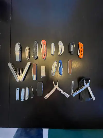 This is a collection of used pocket knives and multi-tools, perfect for collectors or everyday use....