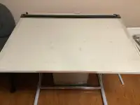Drawing table with sliding parallel rule