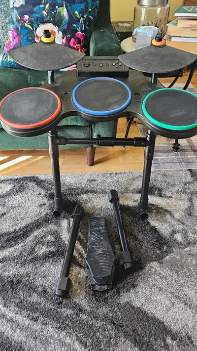 Guitar hero drum set for Playstation 3. The kick pedal needs to be replaced or repaired since the wi...