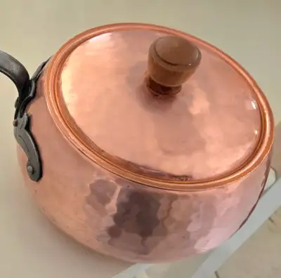Vintage hammered high quality solid copper pot with wooden handle & lid with wooden knob. Lined with...