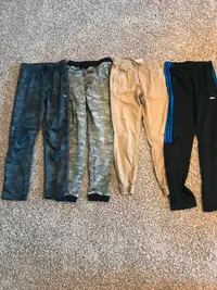 Assorted track style jogger pants. 5 pants, 1 shirt 1 swim short