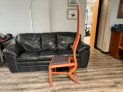 Weird modern art chair. Looks like someone was in the middle of repairing it before I purchased it....