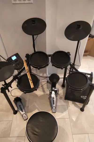 Alesis Nitro electronic drum set with Roland PM-10 amp, View more