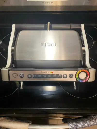 I'm selling a T-fal OptiGrill, perfect for indoor grilling with its intelligent cooking technology....