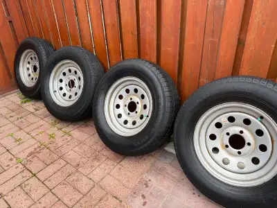 I am selling a set of four 15-inch trailer Rims and very good condition Tires 225/75D15 mounted on s...