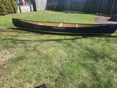 Nova Craft Canoe, Prospector 17, made from Aramid. Rough weight is 46 pounds 2 paddles included. No...