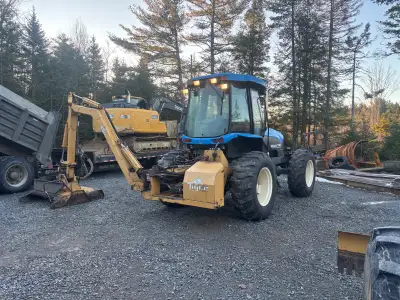 1999 New Holland TV 140. With Tiger 50” rotary boom mower. 4650 hrs. 2 new tires not mounted. Works...