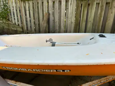 Bombardier 3.8 metre sailboat. Includes mast, rudder, dagger board and sail (not pictured). Has some...