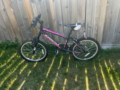 Located in McKenzie Towne Selling a Supercycle Impulse youth hardtail mountain bike with 20-inch whe...
