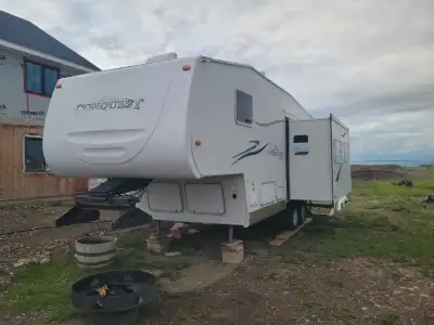 Fully renovated 2006 29 foot Conquest 5th wheel camper. This camper comes with 14 foot slideout. A.C...