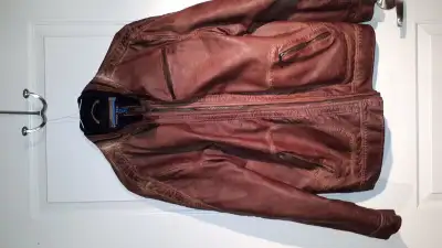 Excellent condition. Good for young men. Size large. Needs a good home. Faux leather.
