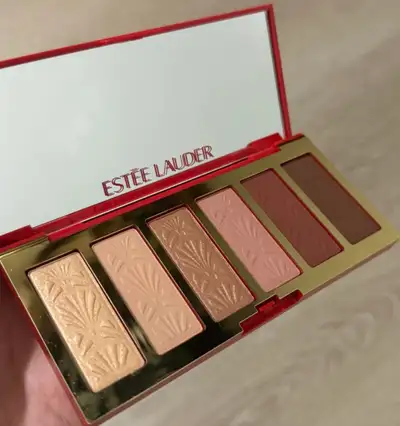 Offering an Estee Lauder palette featuring a range of blushes and highlighters to create a radiant,...