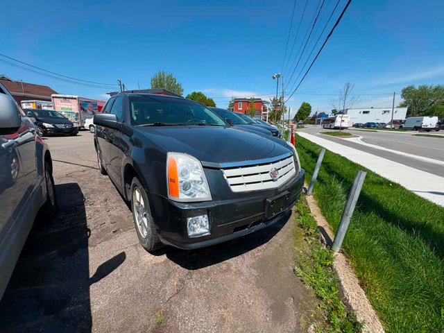 Cadillac SRX 2008 aut. Cruir. toit.AWD $4495. rusty 450-820-0550