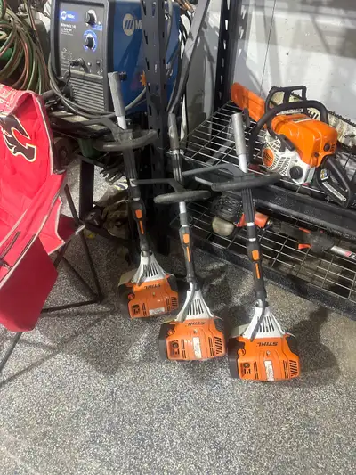 STIHL power head with paddle or broom attachment, View more