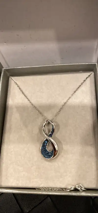 Peoples sterling silver pendant, View more