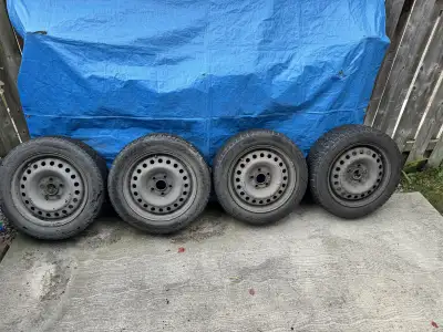 Set of 4 winter tires with rims. Used probably get 1 or 2 winters out of them no flats. Off of an Ac...