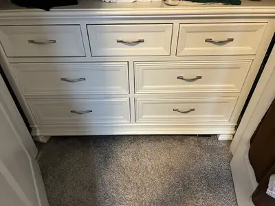 We are on the move and we need to sell our white dresser, two side tables and a bookshelf! Made by K...