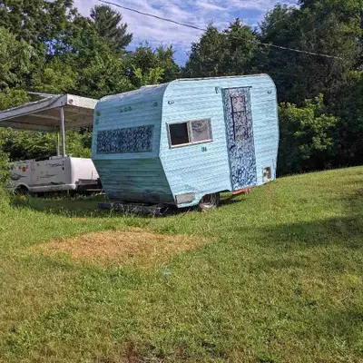 10 ft vintage camper has furnace stove sink tolit we have put a floor down the sheeting will be up t...