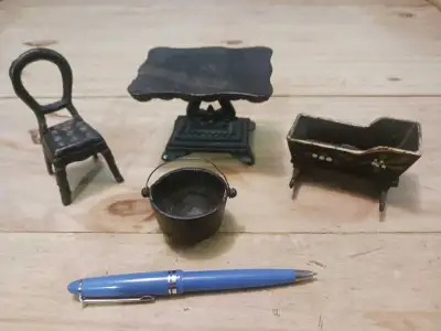 Doll house furniture is cast iron. 10.00 each or all for 35.00. The table has been sold.