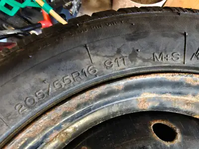 Winter tires withover 80% of tread left on 100 by 5 bolt pattern mounted on steel rims and balanced