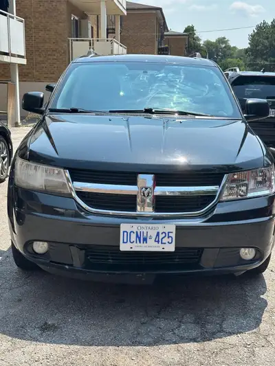 This black 2012 Dodge Journey SXT is ready for adventure! It features a reliable engine and comforta...