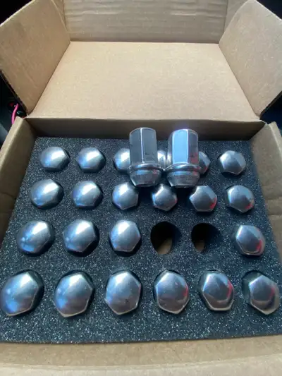 48 new chrome stock lug nuts for GM trucks straight from GM. (2 sets) Will grab pictures when I have...