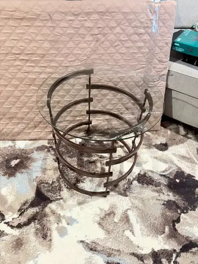 Modern round glass top side table with bronze spiral base, View more