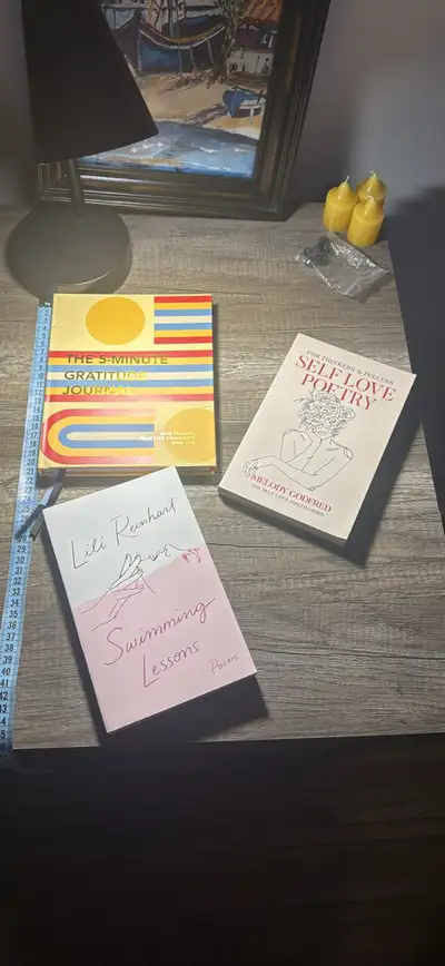 Poetry books and a gratitude journal, View more