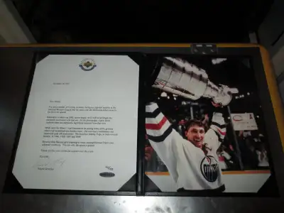 This is the only piece of memorabilia I have ever seen signed by Wayne Gretzky that he has added his...