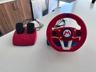 Officially licensed Nintendo product. Includes racing wheel (w/control buttons) and paddles. Support...