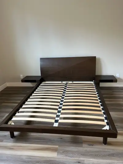 This is a revolve furniture queen-size bed frame, complete with a headboard and two attached floatin...