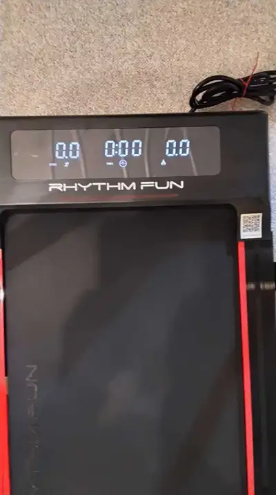 This Rhythmfun 2-in -1 motorized treadmill, model C5, supports a max weight of 300 lbs and operates...