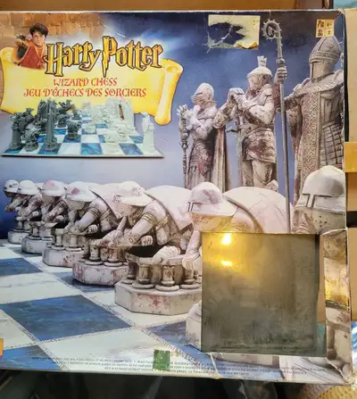 This Harry Potter Wizard Chess set pieces includes all the pieces for a magical game, showing signs...
