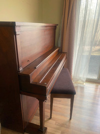 Doherty piano with bench in great condition