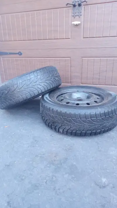 Two used tires for sale on steel rims 215/65/R16. 5 bolt pattern. Removed from KIA Sportage.