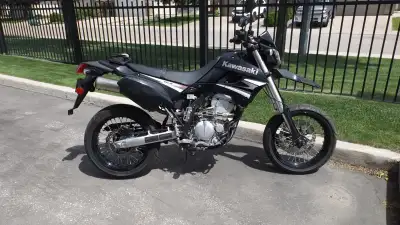 2009 KAWASAKI KLX250 SF SUPERMOTO. Low km 3300km about. Nice original shape. Phone 306-341-0240