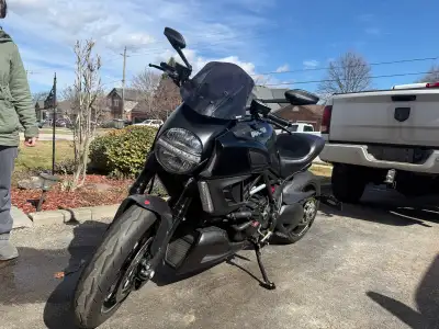 2012 Diavel Carbon with werks exhaust, billet clear clutch cover, carbon fibre fenders, puig tinted...