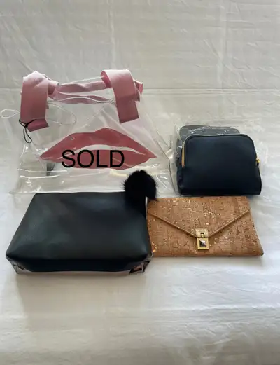 Clear Saks Fifth Avenue bag as shown in pictures (SOLD). Brand new. FURLA clutch in dark blue and go...