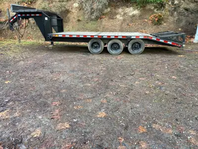 1974 Gooseneck Triple Axle Trailer. Deck is 1' (16.5' +14.5') and was recently redecked. 12000 GVWR.