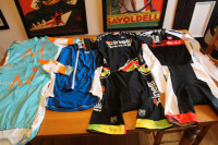 LOT 100 cycling pieces jerseys bibs small med L XL XXL