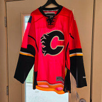 Calgary Flames jersey.   Reebok still with the tags.   Size L