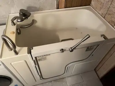 I have a large Walk-in Tub for sale. Tub size is 52 inches long, 32" wide and 38" deep. Has 110v air...