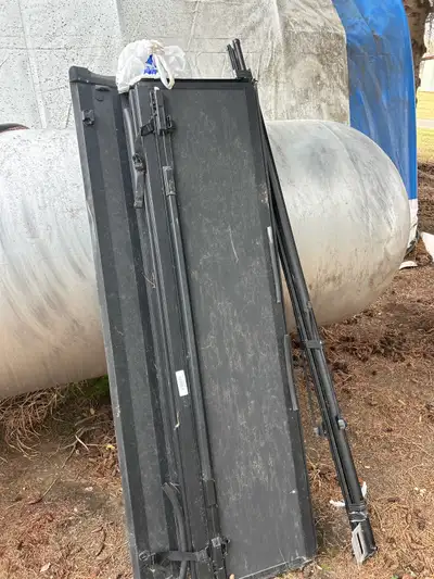 Back flip hard cover Used 3 months. For dodge truck. 6.5 foot box with ram box everything here to in...