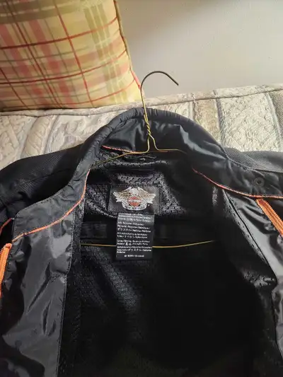 I am selling a women's black Harley-Davidson motorcycle jacket, perfect for any rider looking for st...