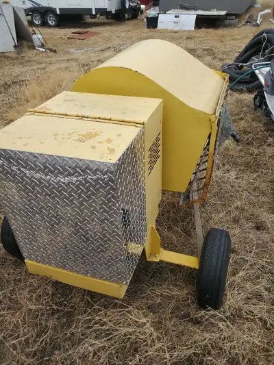 I am selling a cement mixer, designed for brick layers, in used condition. It is yellow, with a silv...