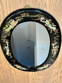 Oval vintage black lacquer mirror